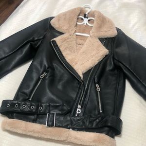 Oversized leather jacket with cream faux fur trim